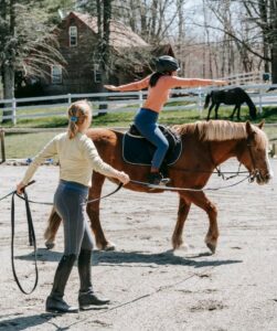 Beginner Rider Taking a Horse-Riding Lesson