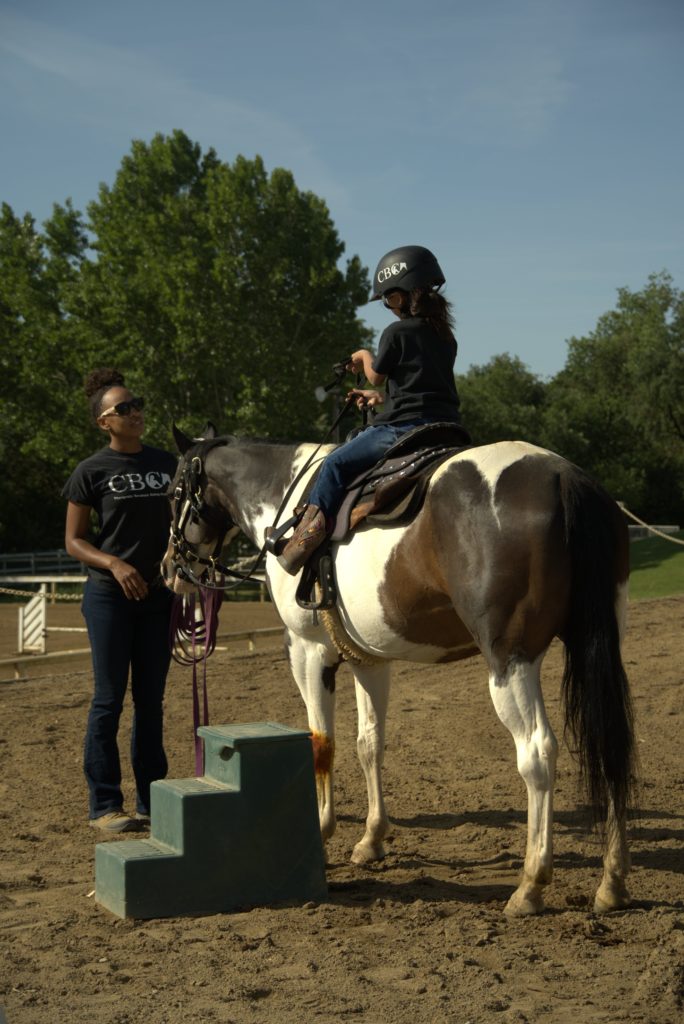 child horse riding lesson