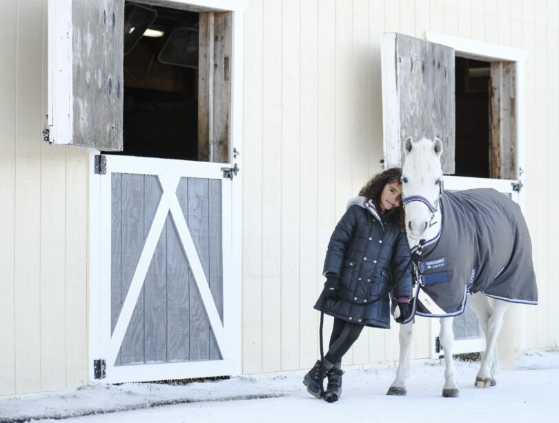 Girl in winter with horse