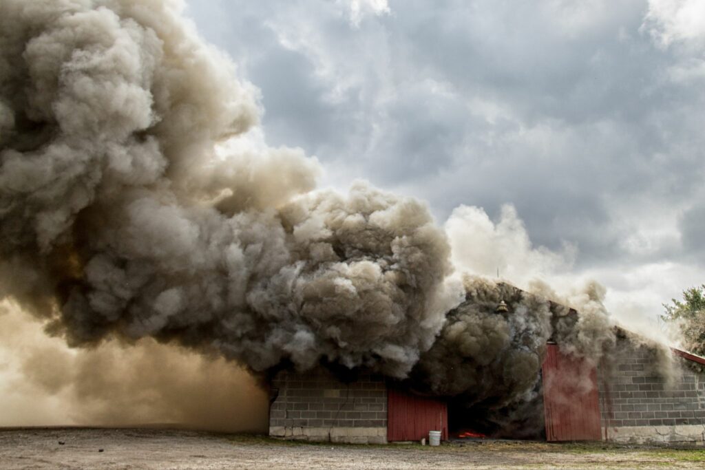 horse barn engulfed in smoke
