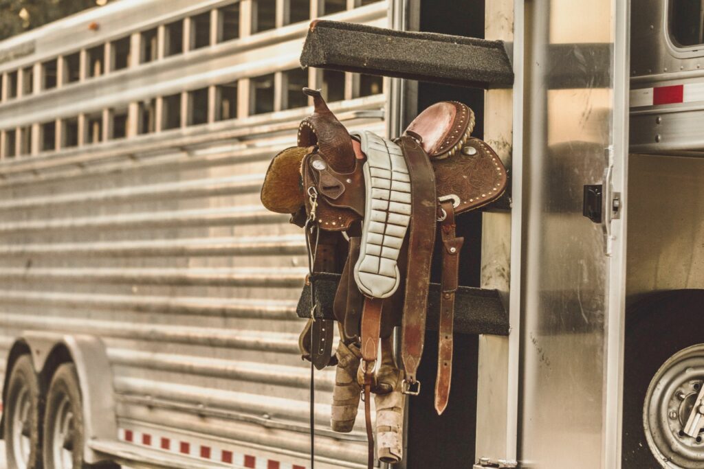 western saddle on horse trailer saddle rack