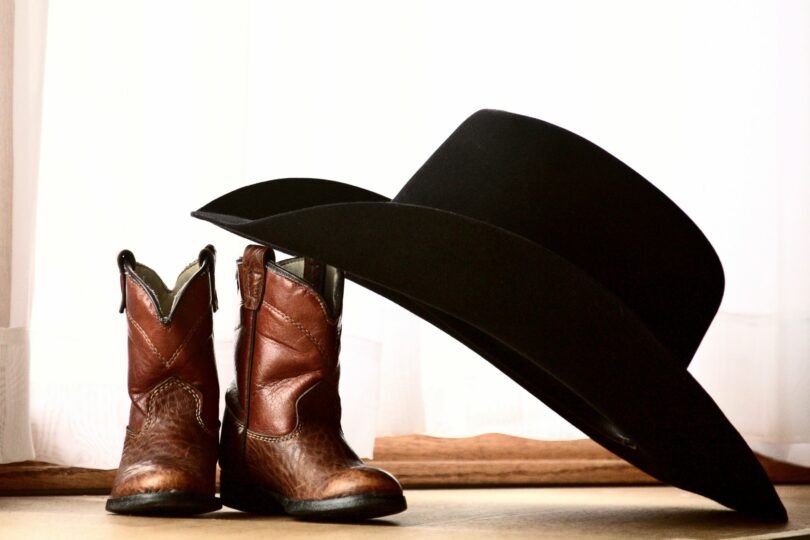 short cowboy boots and black cowboy hat