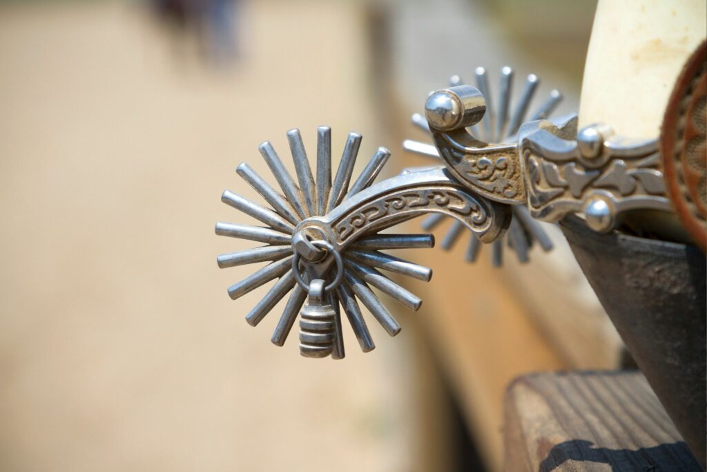silver decorative spurs close up on rowel