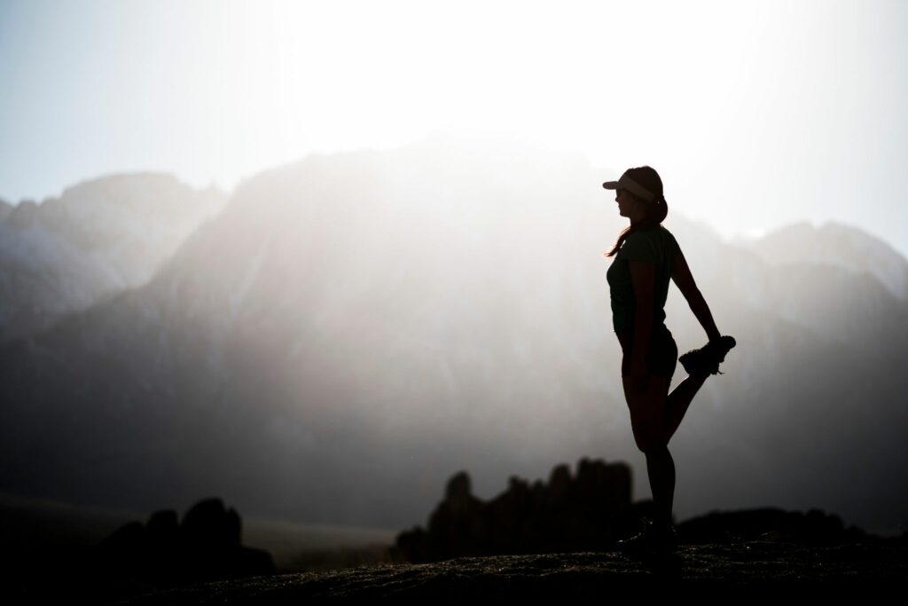 runner in black and white with mountain background