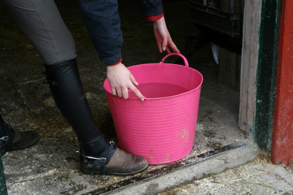 pink bucket with water in it