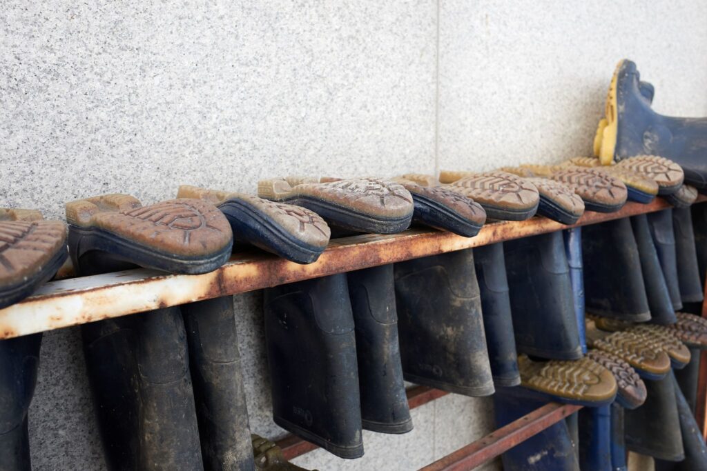 rubber boots in drying rack
