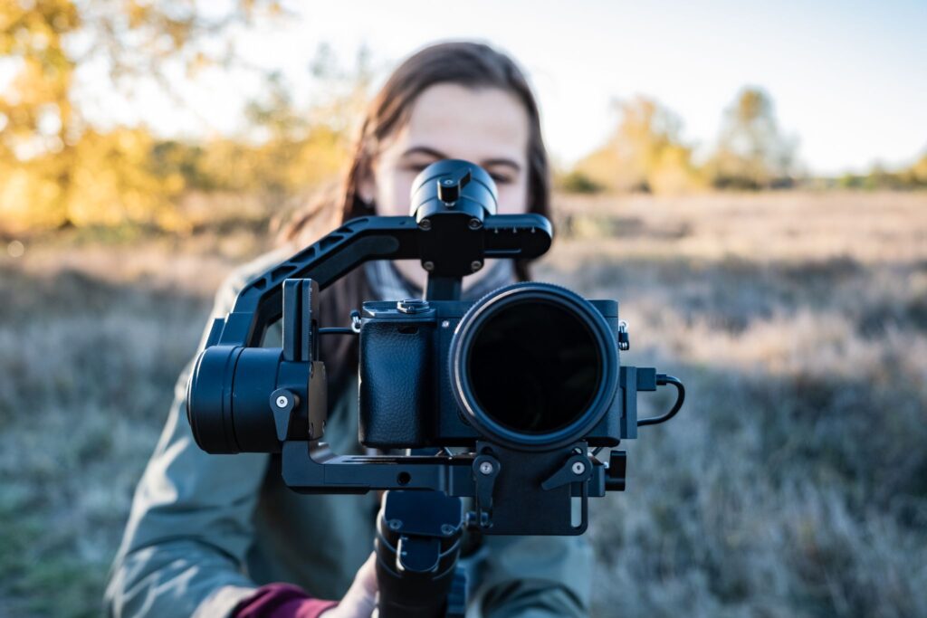 woman with videography equipment