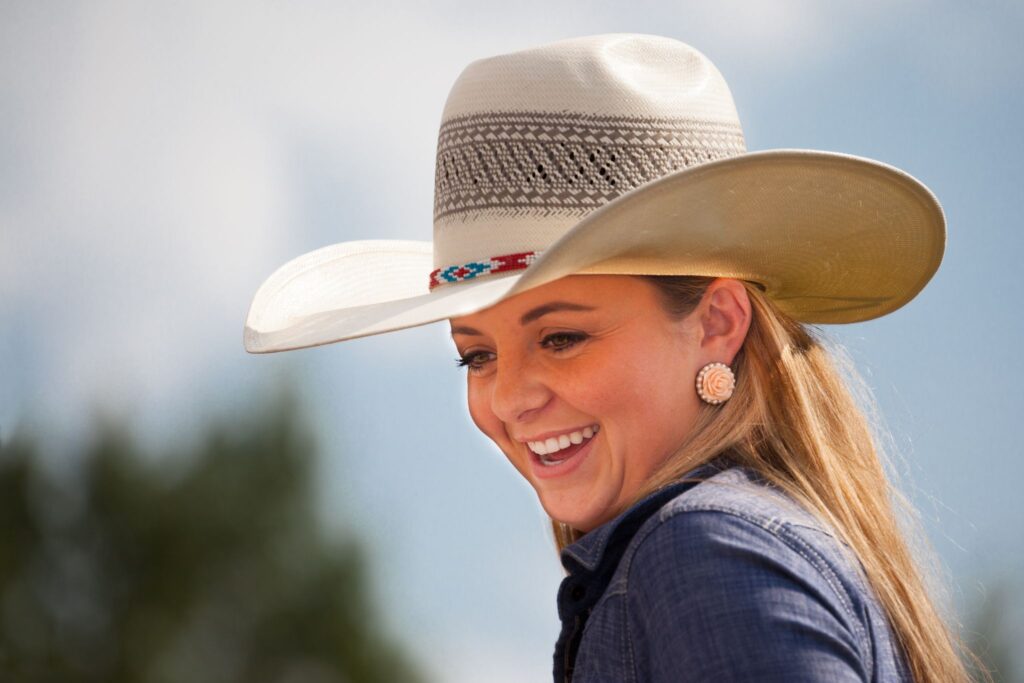 woman wearing straw cowboy hat