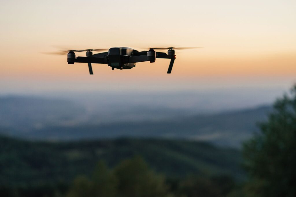 drone in sky at sunset