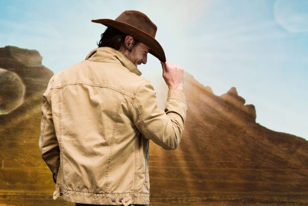 man tipping cowboy hat