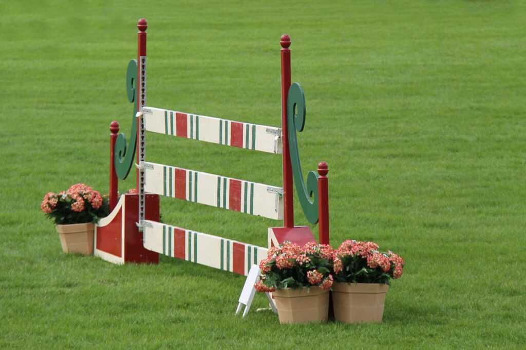 single horse fence white green and red